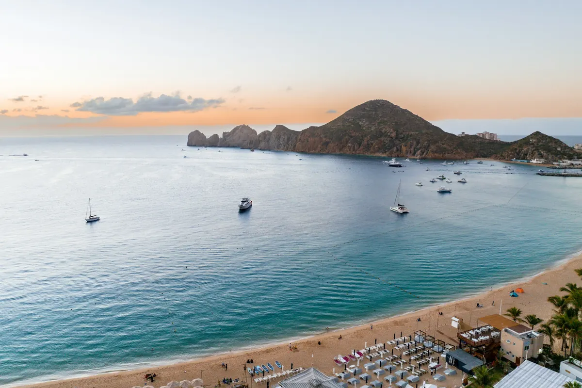A calm bay and long sandy beach at Cabo San Lucas